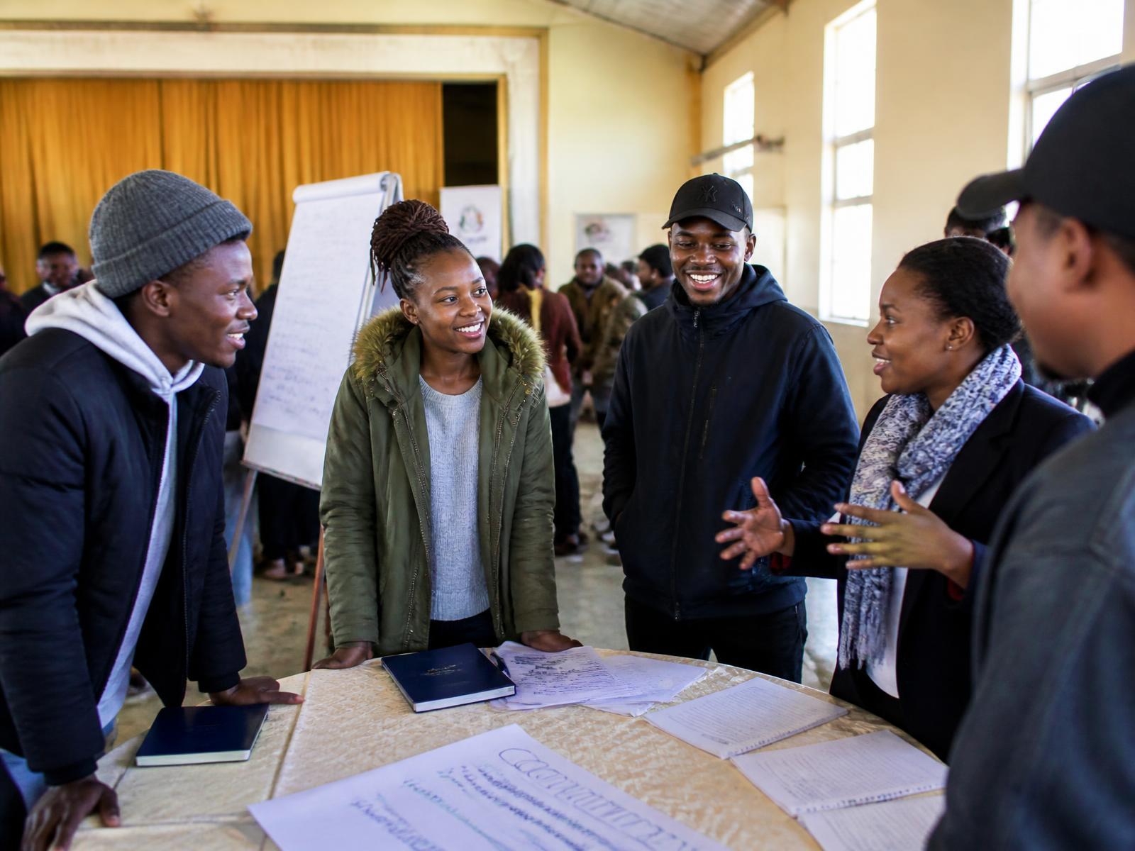 Young Basotho leaders collaborating in a community workshop in Lesotho